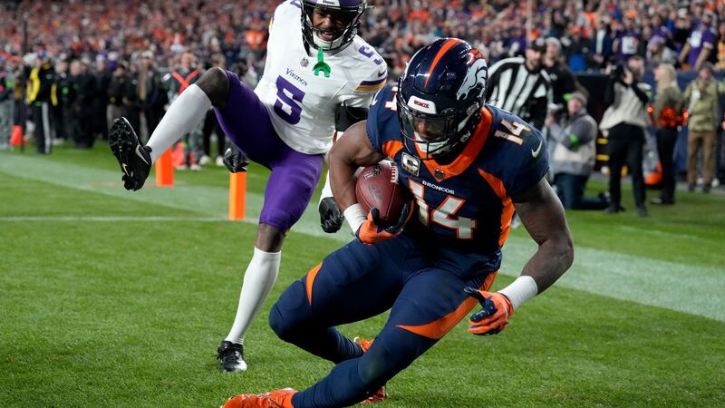 Denver Broncos wide receiver Courtland Sutton (14) pulls in a touchdown as Minnesota Vikings...