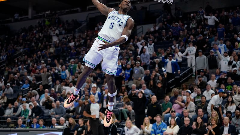 Minnesota Timberwolves guard Anthony Edwards (5) goes up for a dunk during the second half of...