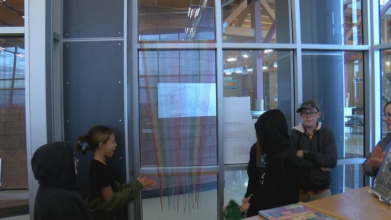 Students unveil their artwork for Hispanic Heritage Month.