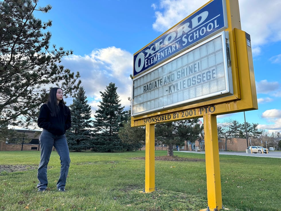 Kylie Ossege stands outside Oxford Elementary School Saturday, Nov. 11, 2021, in Oxford...
