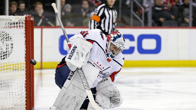 Washington Capitals goaltender Hunter Shepard makes a save against the New Jersey Devils...