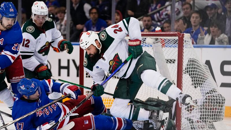 Minnesota Wild's Kaapo Kakko (24) protects his net from New York Rangers' Blake Wheeler (17)...