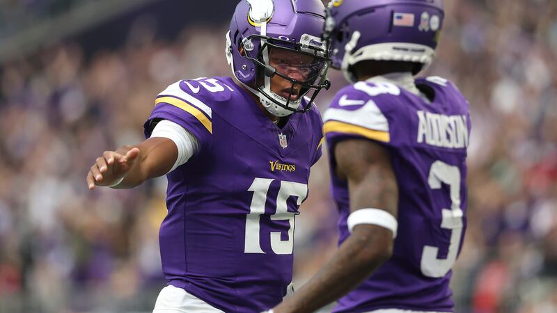 Minnesota Vikings quarterback Joshua Dobbs (15) celebrates with wide receiver Jordan Addison...