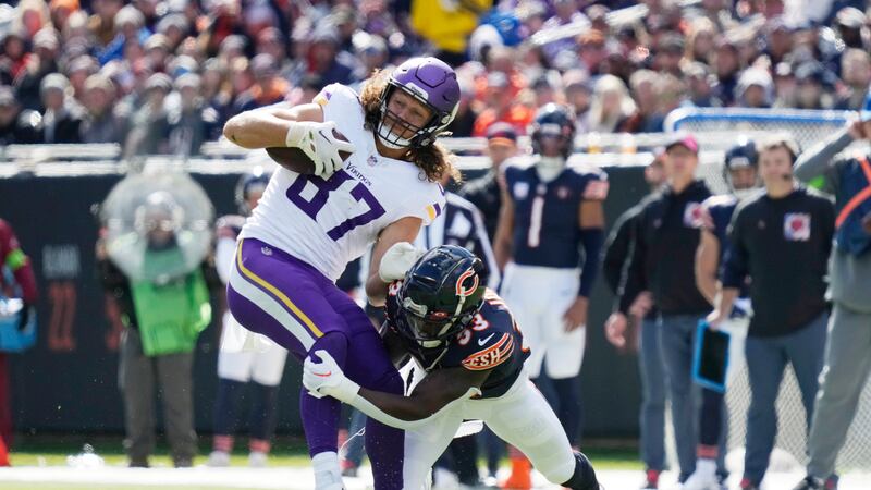 Minnesota Vikings tight end T.J. Hockenson (87) is tackled by Chicago Bears linebacker T.J....