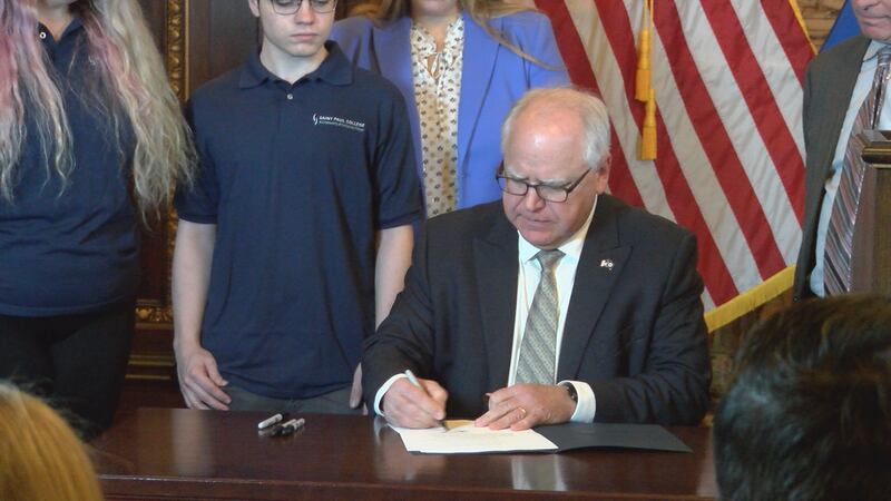 Gov. Tim Walz signing Executive Order