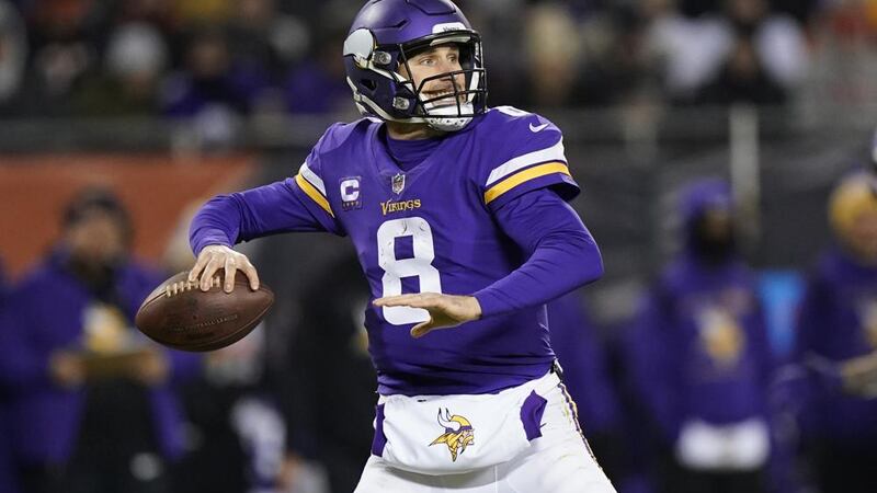 Minnesota Vikings quarterback Kirk Cousins passes during the first half of an NFL football...