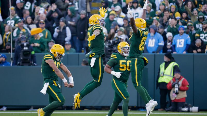 Green Bay Packers quarterback Jordan Love, left, and teammates react after a play against the...