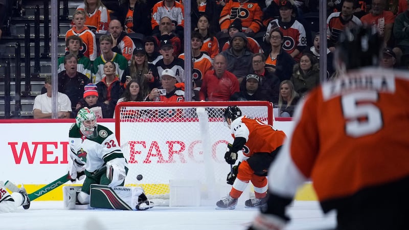 Philadelphia Flyers' Bobby Brink (10) scores a goal against Minnesota Wild's Filip Gustavsson...