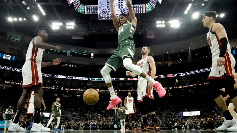 Milwaukee Bucks' Giannis Antetokounmpo dunks during the second half of an NBA basketball game...
