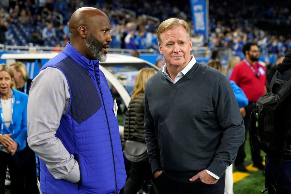 Detroit Lions general manager Brad Holmes, left, talks with NFL Commissioner Roger Goodell...