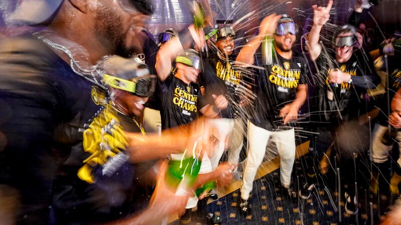 Milwaukee Brewers' players celebrate after clinching the National League Central Division...